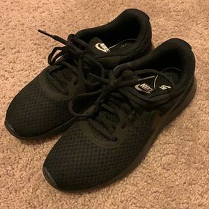 All black Nike sneakers